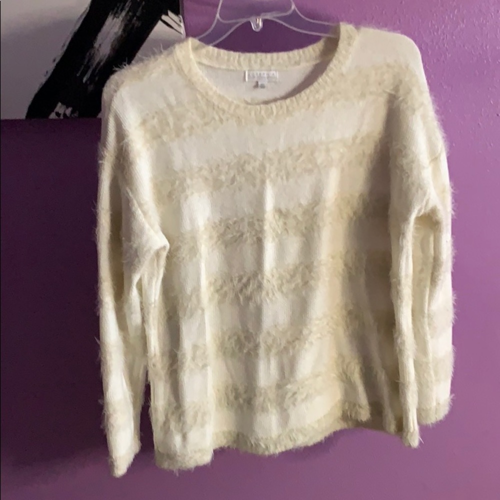 Cream colored sweater with a bit of fuzzies